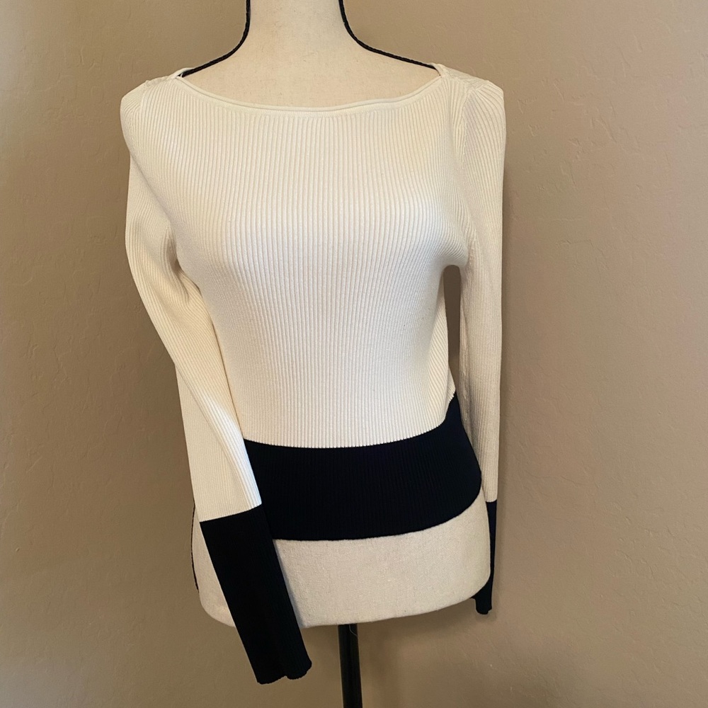 Black and white long sleeve waist length sweater